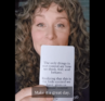 Justine Froelker reading a card from her courage deck