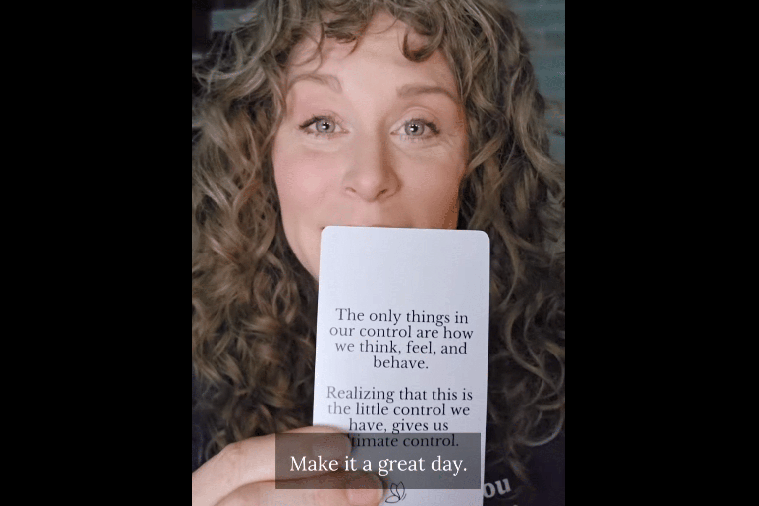 Justine Froelker reading a card from her courage deck